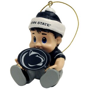 ornament child sitting with Penn State on cap holding Athletic Logo